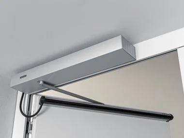 How Do Automatic Sliding Doors and Swing Handicap Operators Improve Accessibility in Commercial Spaces?